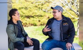 Two students talking outside Two students talking outside